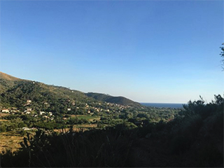 mountainside village under blue sky