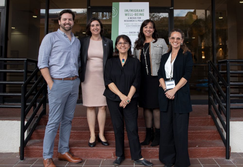 Conference leadership team poses for a photo outside the Hilton Bayfront.