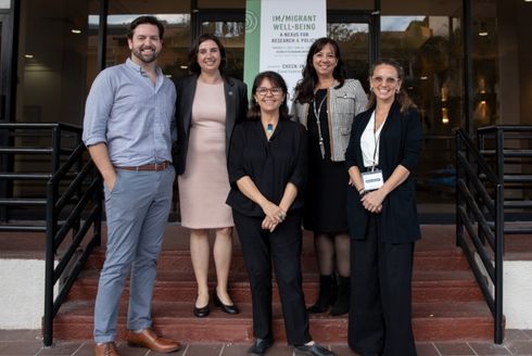 Conference leadership team poses for a photo outside the Hilton Bayfront.