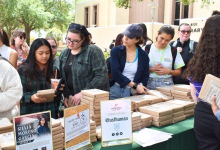 Students browsing wrapped books
