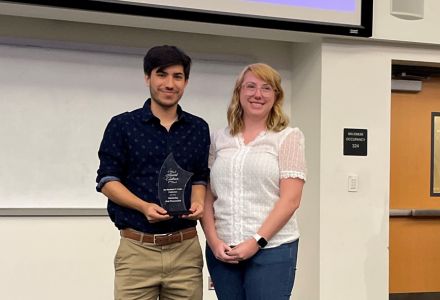 First-place winner Julian Melendez, graduate student, accepting his award