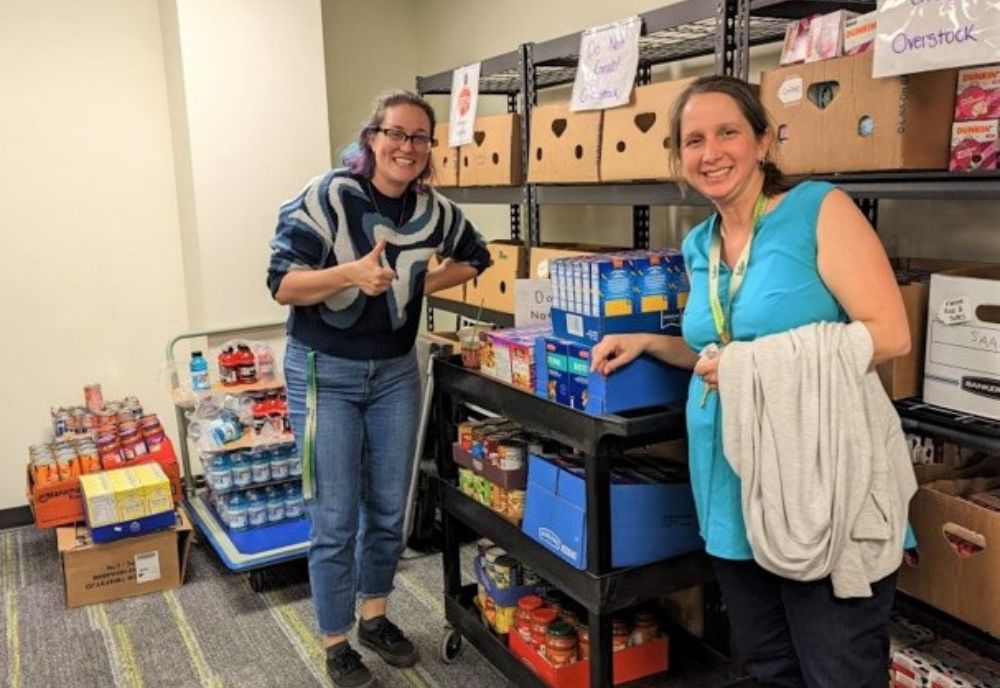 Mary Collins and Tess Ippolito deliver donations to Feed-A-Bull Pantry. (Photo courtesy of Tarin Haydt)