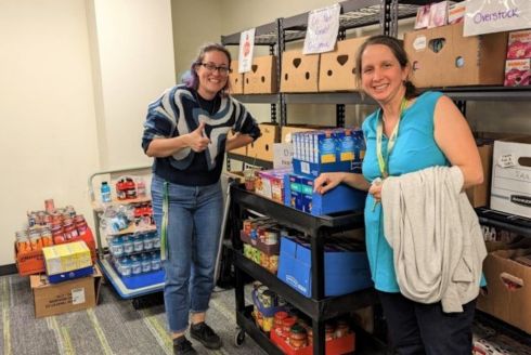 Mary Collins and Tess Ippolito deliver donations to Feed-A-Bull Pantry. (Photo courtesy of Tarin Haydt)