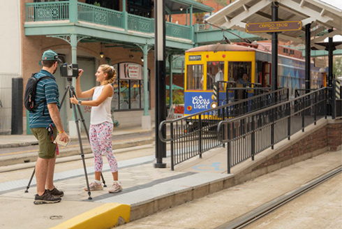 Students Sean Wissler (left) and Amber Brocki (right) laser-scan the HART TECO streetcars at Centro Ybor Station. (Photo by Alessandra Casanova)