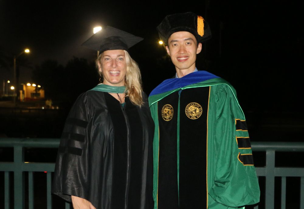 Dr. Jennifer Collins (left) and Yijie Zhu (right) after a graduation ceremony. (Photo courtesy of Yijie Zhu)