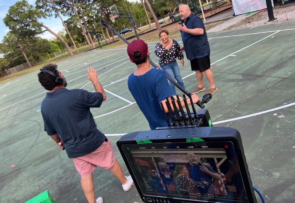 Mario Garcia (left) and actors Justina Machado (middle) and Will Sasso (right), on the set of “The Throwback”. (Photo courtesy of Mario Garcia)