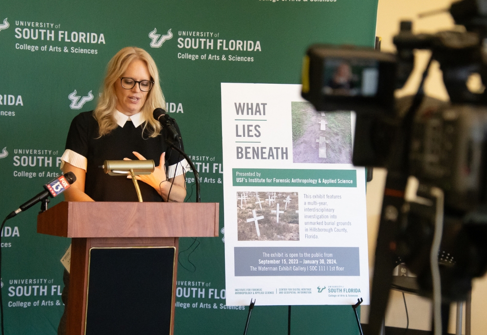 Dr. Erin Kimmerle speaks to members of the media the exhibit’s opening event. (Photo by Corey Lepak)