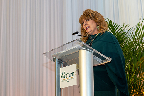 Colleen Chappell accepting the Lifetime Achievement award at the WLP symposium. (Photo courtesy of John Tipton & Mridula Singh)