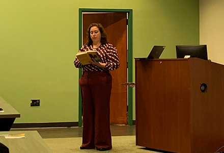 Rebecca Campbell-Montalvo reads an excerpt of her book to event attendees. (Photo courtesy of Oxana Sidorova)