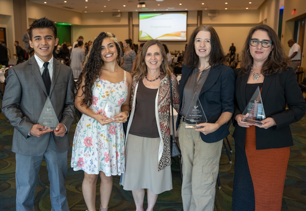 USF College of Arts and Sciences congratulated four awardees at this year’s Status of Latinos (SoL) Hispanic Heritage Month awards ceremony. (From left) Elvis Rodriguez, Barbara Herrera, CAS Interim Dean Magali Michael, Dr. Susan Mooney, and Dr. Natalie Scenters-Zapico. (Photo by Corey Lepak)