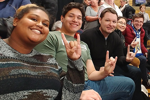 (From Left) USF students Asia Anderson, Eduardo Fox-Velazquez, associate professor Joshua Scacco, USF students Camila Cernawsky Nakandakari, and Aldo Puccinion, on a research field trip to the Iowa caucuses in 2020. (Photo courtesy of Joshua Scacco)