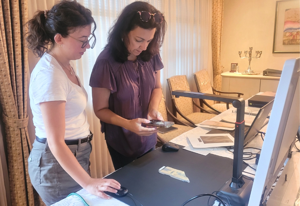 IDEx team members digitizing a Star of David badge sewn onto a piece of a concentration camp prisoner’s uniform. (Photo courtesy of Dr. Davide Tanasi)