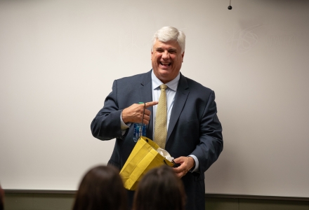 State prosecutor, Nicholas B. Cox, accepting a gift after the Bulls in Action presentation. (Photo by Corey Lepak)