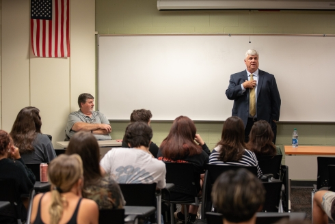 State prosecutor, Nicholas B. Cox, presenting at the Bulls in Action alumni speaker series. (Photo by Corey Lepak)