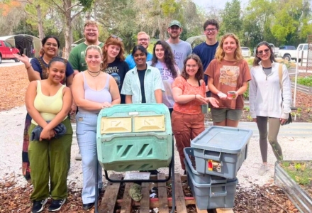 Saravana (center) with their fellow Agrarian Club members setting up for an event at the Botanical Gardens. (Photo courtesy of Dharsh Saravana)