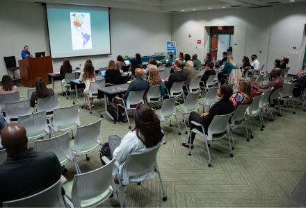 Community Historian of Tampa Bay Maura Barrios walked attendees through a history of the Latin American population growth in the Tampa Bay region. (Photo by Corey Lepak)