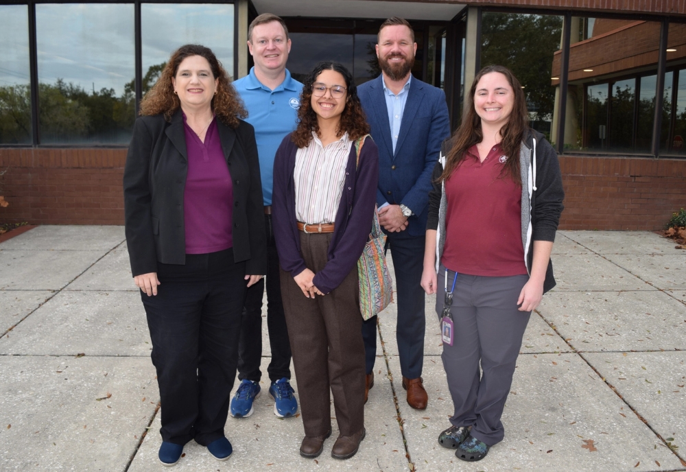 (From left, first row) Elaine DeLeeuw, administration director; Evalyse Sanabria, GIS intern; Abbie Weeks, wetlands scientist. (From left, back row) Chris Boland, GIS administrator; Michael Lynch, wetlands director. (Photo courtesy of Evalyse Sanabria)