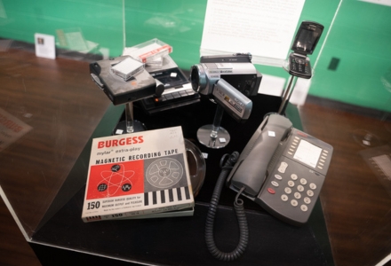 Artifacts used for ethnographic research by anthropology faculty include magnetic reel-to-reel recording tape, portable cassette recorders, handheld video recorders, landline and flip phones, (all now largely replaced by smart phones). (Photo by Corey Lepak)