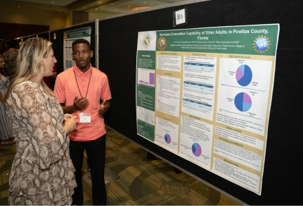 Dr. Jennifer Collins, professor in the School of Geosciences and principal investigator on Weather, Climate, and Society REU, with REU student Zion Powell who presented his summer research at the USF Undergraduate Symposium in July. (Photo by Corey Lepak)