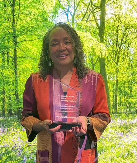 Cheryl Rodriguez holding award
