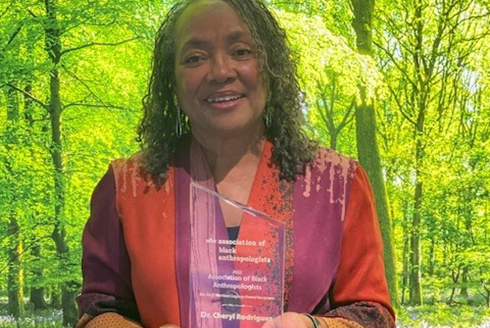 Cheryl Rodriguez holding an award