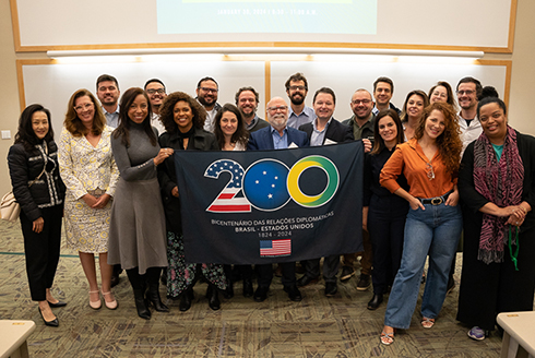 Participants of the Journalism & Democracy Program and attendees at the recent CAS Democracy and Citizenship Series pose with keynote speaker journalist Rosental Calmon Alves (center). (Photo by Corey Lepak)