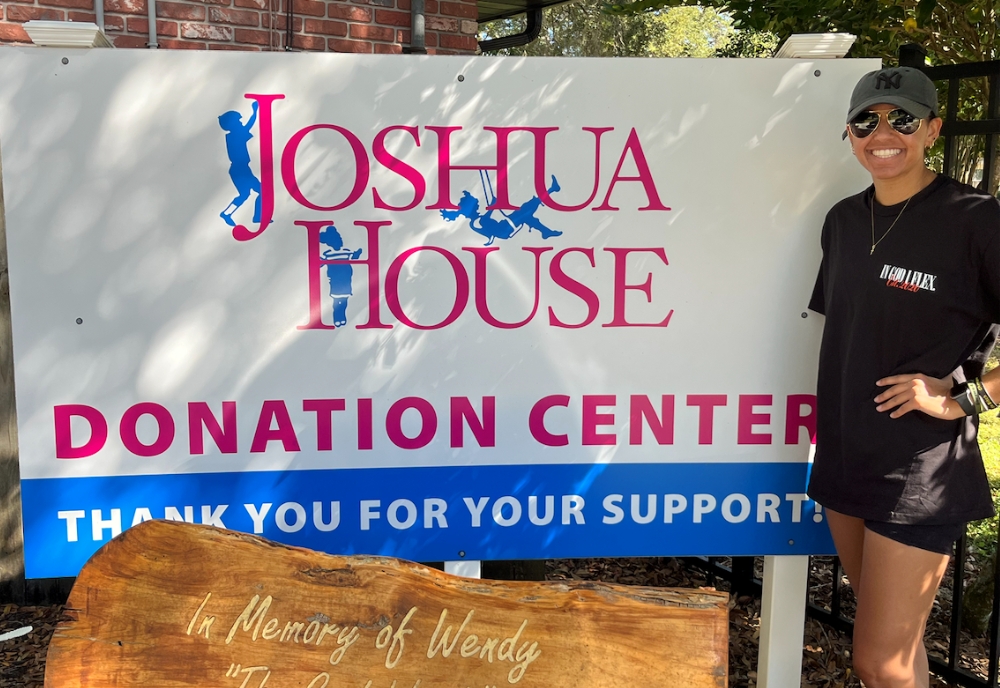 Recent USF graduate, Devyne Davis pictured outside of the Joshua House non-profit organization. (Photo courtesy of Devyne Davis)