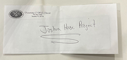 The $500 check donated by Friendship C.M.E. Church to the Joshua House project. (Photo courtesy of Devyne Davis)