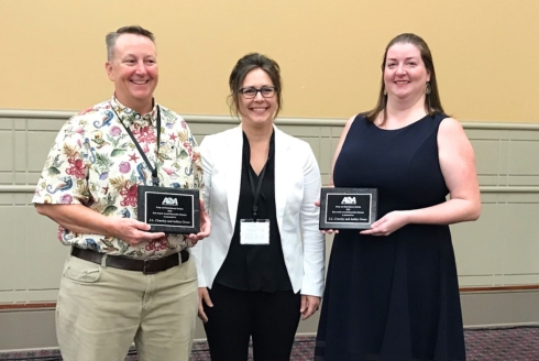 (From left) Dr. S.L. Crawley and Dr. Ashley Green (right), accepting their award from the American Sociology Association for their work featured in The Oxford Handbook of Symbolic Interaction. (Photo courtesy of Dr. S.L. Crawley)