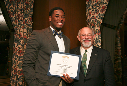 DSLS alumnus Dr. Jeremy Lomax pictured with former Dean Eric Eisenberg during the DSLS Induction Ceremony in 2014. (Photo courtesy of Lauren Taylor)