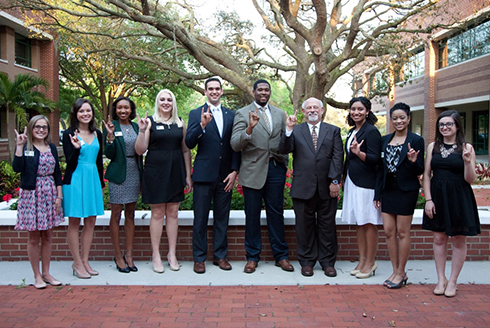 Jeremy Lomax (fifth from right) standing next to former College of Arts and Sciences Dean Eric Eisenberg (fourth from right) with the DSLS class of 2014. (Photo courtesy of Jeremy Lomax)