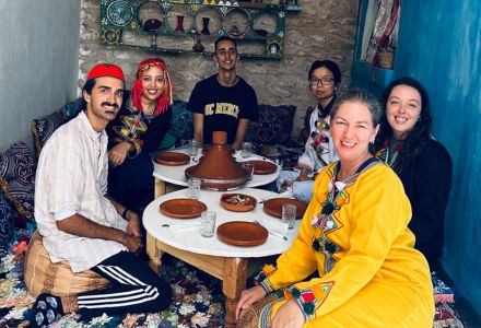 Field school participants seated for a traditional Moroccan meal. (Photo courtesy of Tara Deubel)
