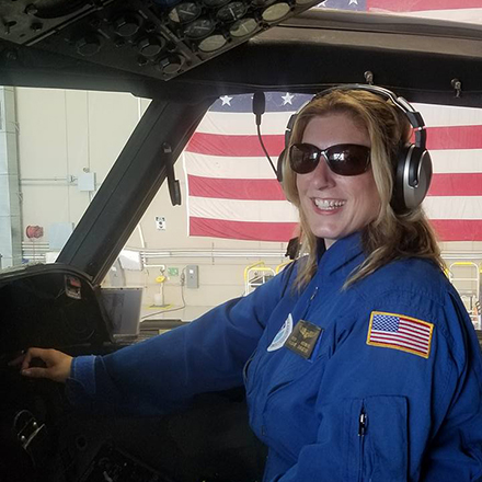 Dr. Jennifer Collins on site at the National Oceanic & Atmospheric Administration’s Hurricane Hunters plane hangar. Collins flew with the group during Hurricane Sandy in 2012. (Photo courtesy of Jennifer Collins)