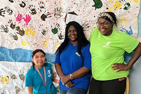 Mojisola Adewumi (center) and her co-workers at the Upper Keys YMCA Program center. (Photo courtesy of Mojisola Adewumi)