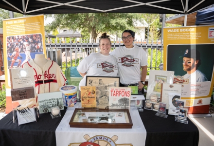 Arminda Mata (left) and Rose Lopez (right) working at the Ybor City Museum Society's Rollin’ Through History Mobile Museum. (Photo by Corey Lepak)