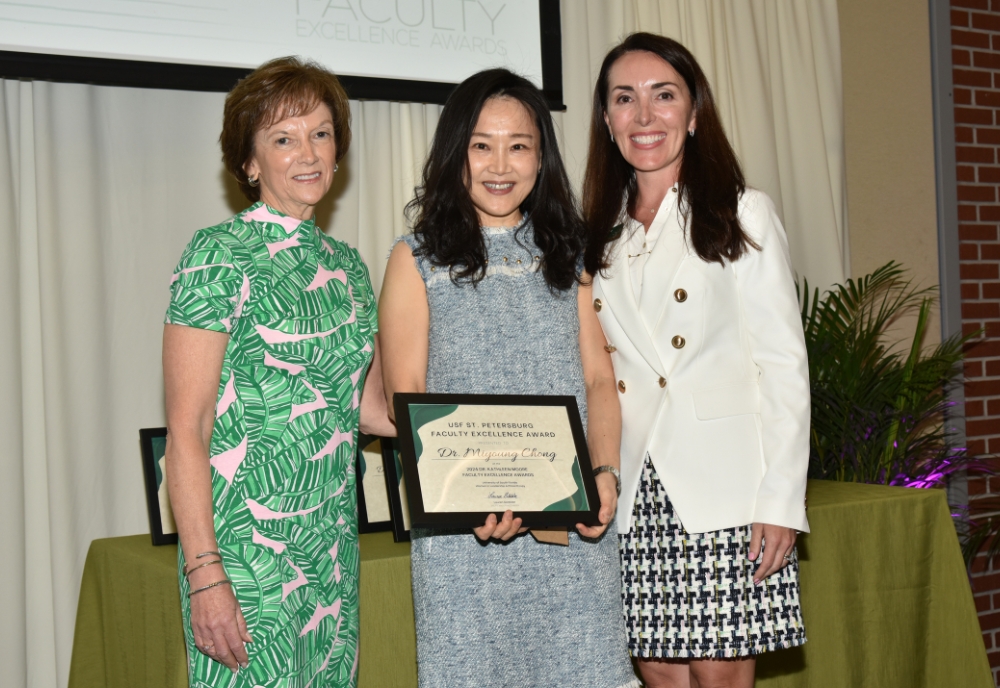 Dr. Miyoung Chong (center) is a recipient of the WLP’s 2024 Dr. Kathleen Moore Faculty Excellence Award. (Photo courtesy of Miyoung Chong)