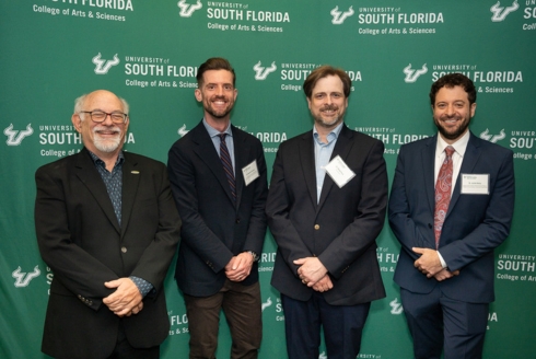 (From left) Dr. Eric M. Eisenberg, Senior Vice President for University-Community Partnerships; Dr. Michael DeJonge, James F. Strange Chair; Dr. Steven M. Vose, assistant professor in the Department of History and holder of the Bhagwan Suparshvanatha Professorship in Jain Studies at the University of Colorado-Denver; and Dr. Justin Henry, Bhagwan Padma Prabhu Endowed assistant professor. (Photo by Corey Lepak)