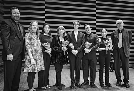 The CRESCENDO researchers (from left), Matthew McCutchen, Dr. Heather O'Leary, Grace Oh, Carrie Clarke, Huron Falkenburt, Hunter Pomeroy, Elis Jones, and Paul Reller following the performance by the USF Symphonic Band and Wind Ensemble concert on Feb. 12th. (Photo by Aiden Michael McKahan)