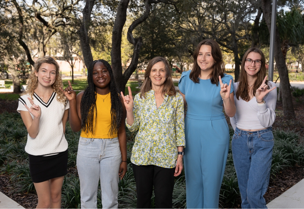 USF College of Arts and Sciences Interim Dean Magali Michael (center) met with some of this year’s WLP Scholars to commemorate International Women’s Day. Photographed (from left) includes Jenna Epright, Phalandine Noel, Dean Michael, Reaghan Ard, and Shelby-Lynn Pitre. (Photo by Corey Lepak)