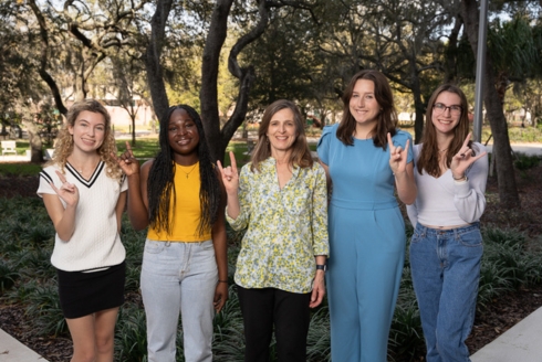 USF College of Arts and Sciences Interim Dean Magali Michael (center) met with some of this year’s WLP Scholars to commemorate International Women’s Day. Photographed (from left) includes Jenna Epright, Phalandine Noel, Dean Michael, Reaghan Ard, and Shelby-Lynn Pitre. (Photo by Corey Lepak)