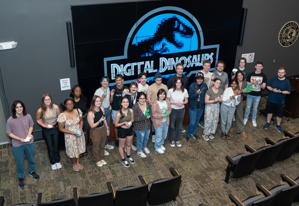 Students hold their 3D-printed projects at the conclusion of final presentation week in the Advanced Visualization Center. (Photo by Corey Lepak)