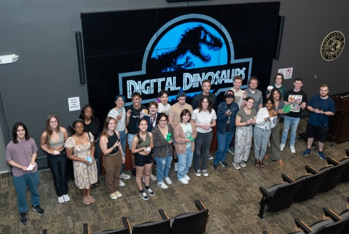 Students hold their 3D-printed projects at the conclusion of final presentation week in the Advanced Visualization Center. (Photo by Corey Lepak)