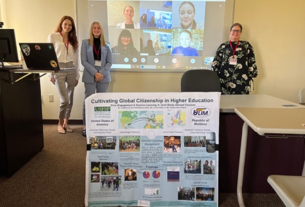 Taylor Herman (second from left) with Dr. Judithanne McLauchlan (right) during her freshman research presentation at the Florida Political Science Association Annual Conference. (Photo courtesy of Taylor Herman)