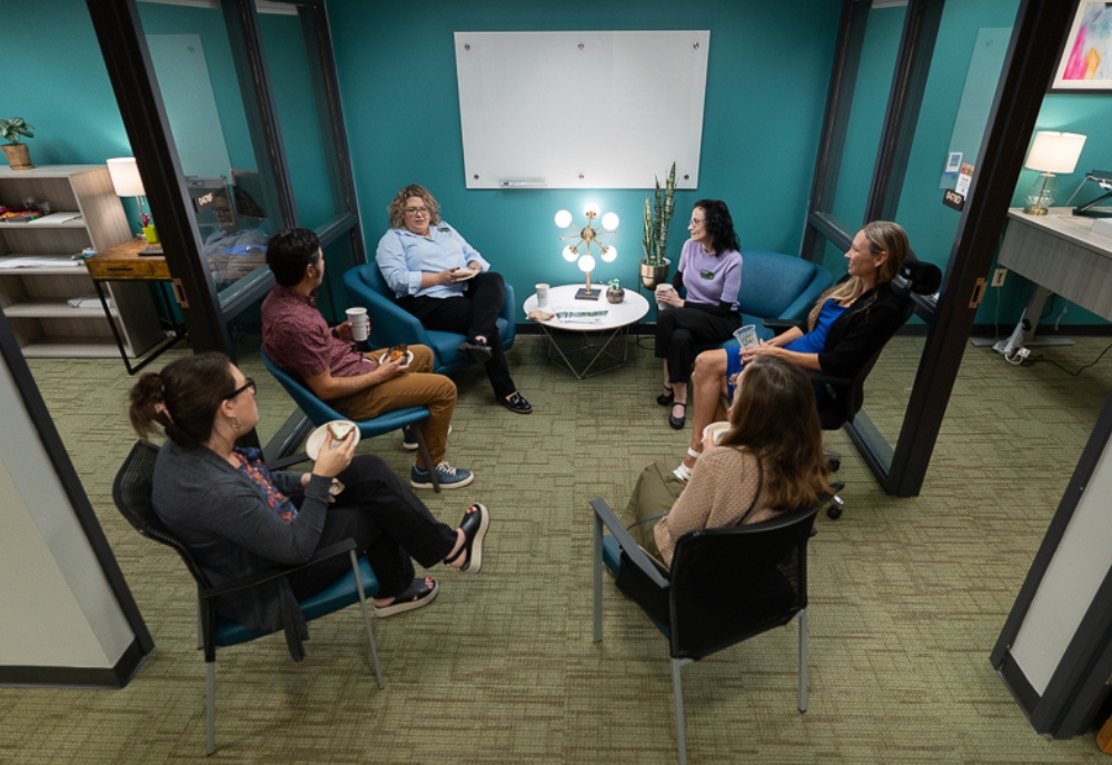 Attendees at the Humanities Institute open house event enjoying breakfast in the newly renovated office space. (Photo by Corey Lepak)