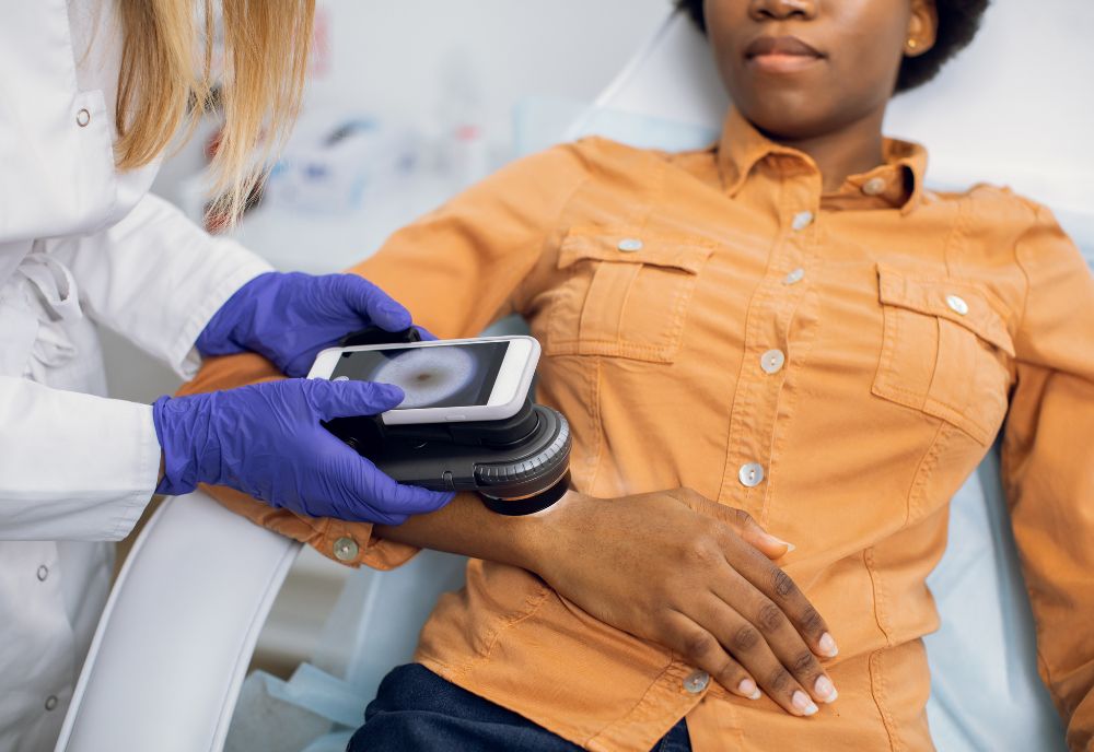 Woman's arm being scanned for cancer cells