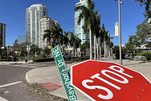 A stop sign toppled by Hurricane Milton in St. Petersburg. (Photo by Mary Shedden, WUSF)
