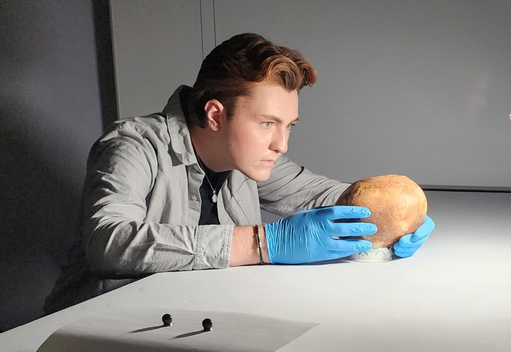 Eylward’s interdisciplinary approach to analyzing skeletal remains harnesses innovative technology as well as traditional, hands-on methods. (Photo courtesy of Aiden Eylward)