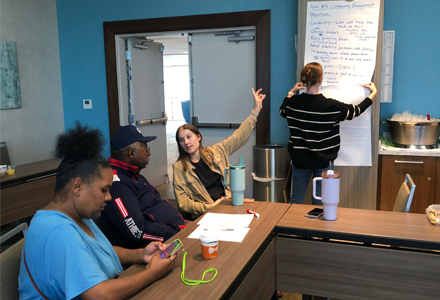 Vidmar (center) working with Port St. Joe community leaders discussing future action plans in the area. (Photo courtesy of Abby Vidmar)