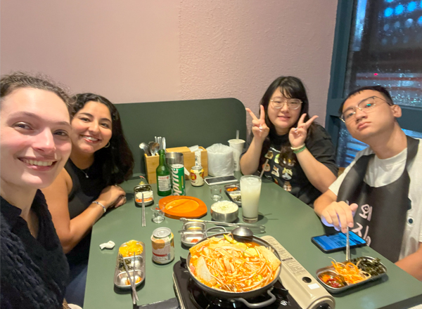 Virzi and Keidel share meals and stories with new friends while abroad.
