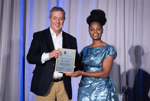 Steven Wilson (left) was formally recognized at an awards ceremony at the National Communication Association (NCA) annual meeting in New Orleans this past November (2024). Wilson is pictured with Dr. Marnel Niles Goins, NCA President and Dean of the School of Communication at American University. The Distinguished Scholar Award is the highest award given by NCA. Wilson delivered a short talk about his career at the meeting and thanked those who have mentored and supported him over the years. “I look forward to continuing to pass that on to the graduate students I work with now,” he said. (Photo courtesy of Dr. Kai Kuang)
